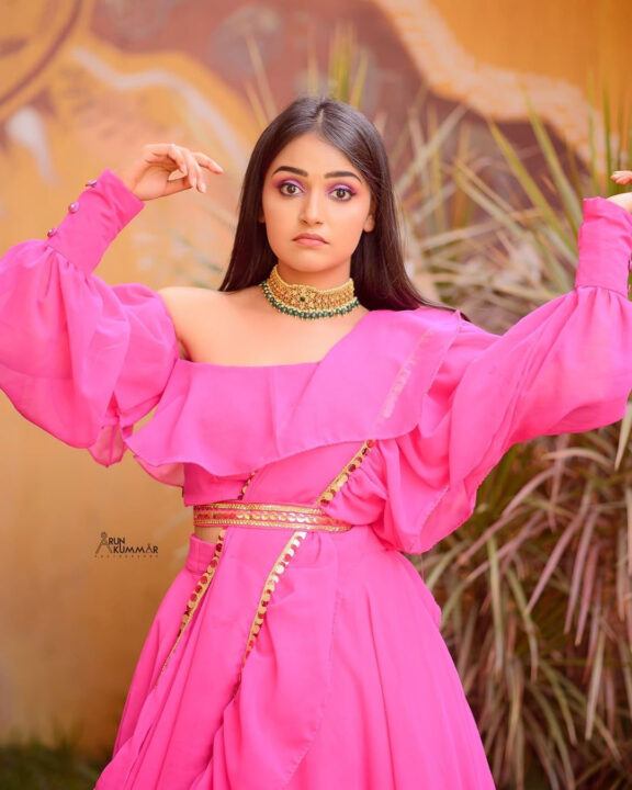 Nisha Ravikrishnan in pink dress photoshoot stills