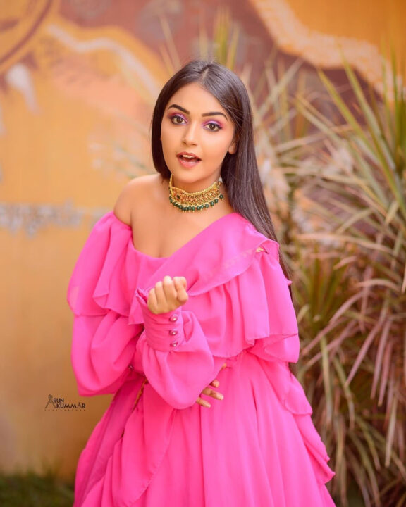 Nisha Ravikrishnan in pink dress photoshoot stills