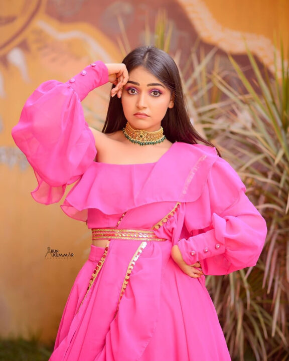 Nisha Ravikrishnan in pink dress photoshoot stills