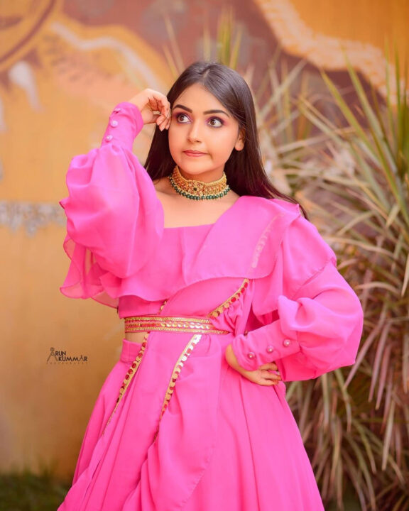 Nisha Ravikrishnan in pink dress photoshoot stills