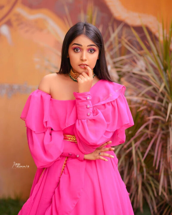 Nisha Ravikrishnan in pink dress photoshoot stills