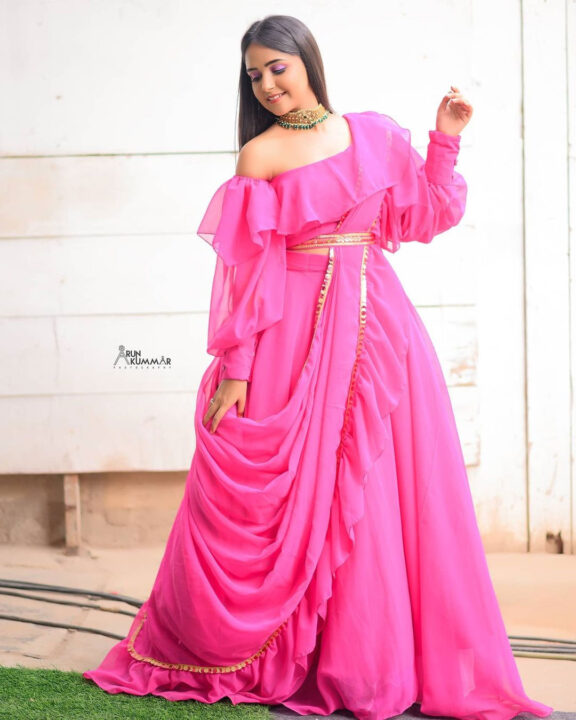 Nisha Ravikrishnan in pink dress photoshoot stills