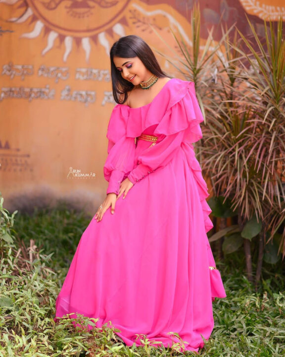 Nisha Ravikrishnan in pink dress photoshoot stills