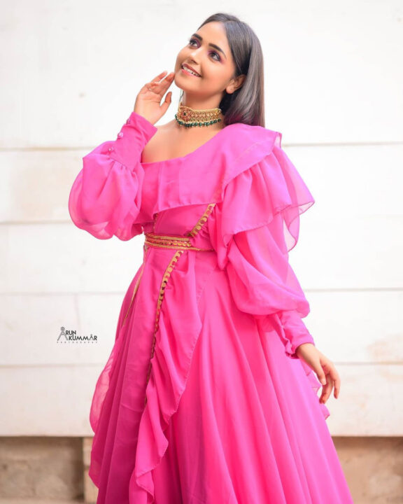 Nisha Ravikrishnan in pink dress photoshoot stills