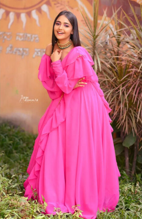 Nisha Ravikrishnan in pink dress photoshoot stills