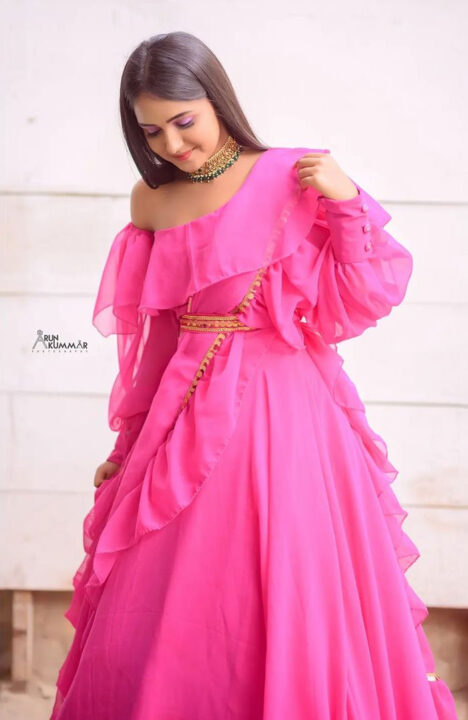 Nisha Ravikrishnan in pink dress photoshoot stills