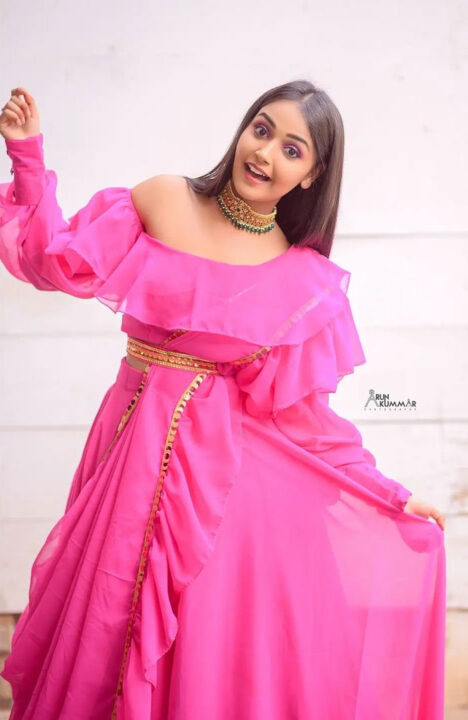 Nisha Ravikrishnan in pink dress photoshoot stills