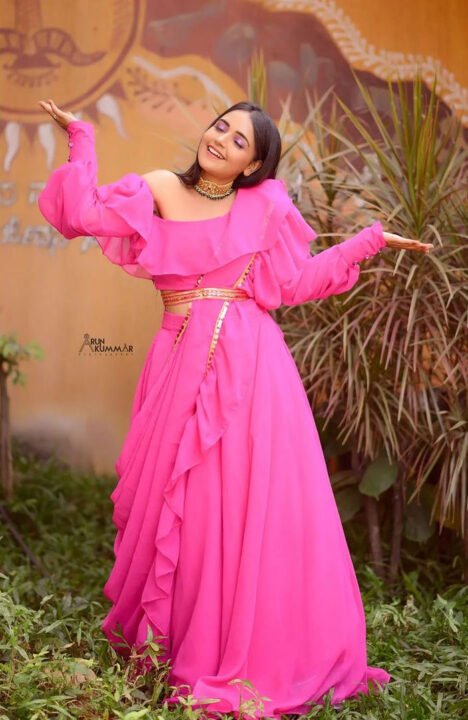 Nisha Ravikrishnan in pink dress photoshoot stills