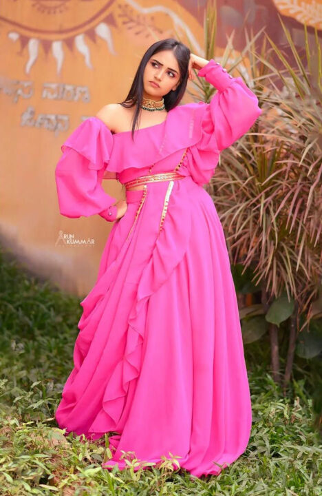 Nisha Ravikrishnan in pink dress photoshoot stills