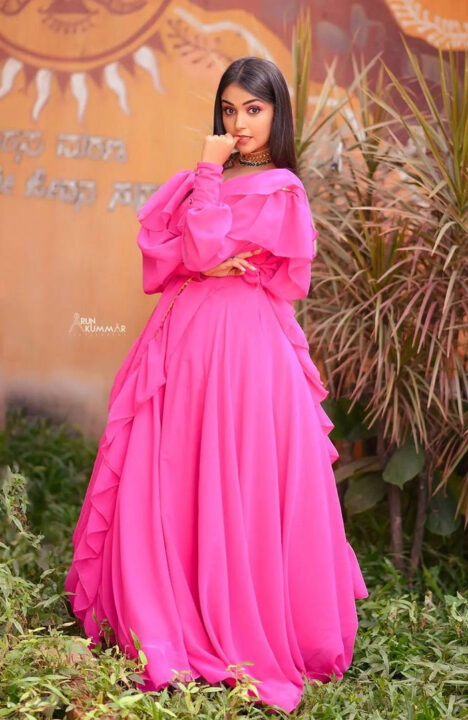 Nisha Ravikrishnan in pink dress photoshoot stills