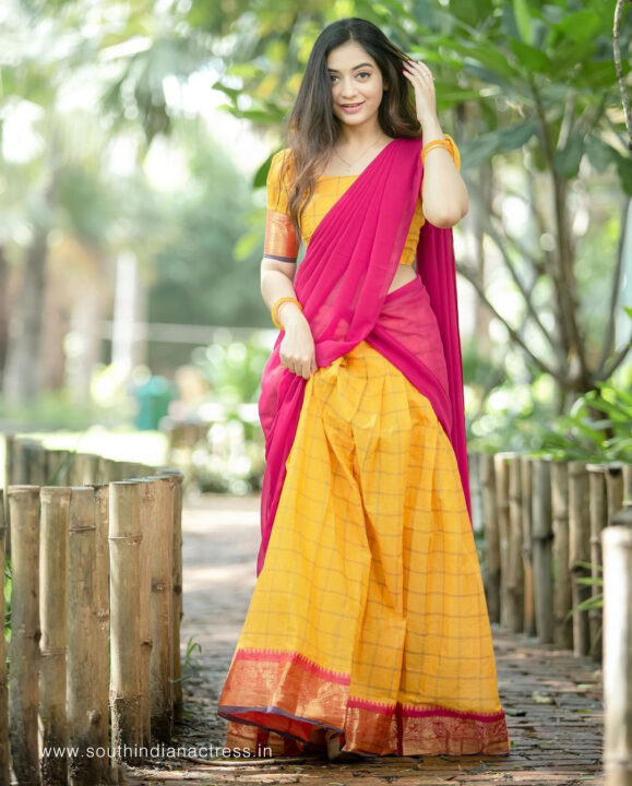 Athmika Sumithran in yellow and pink half saree