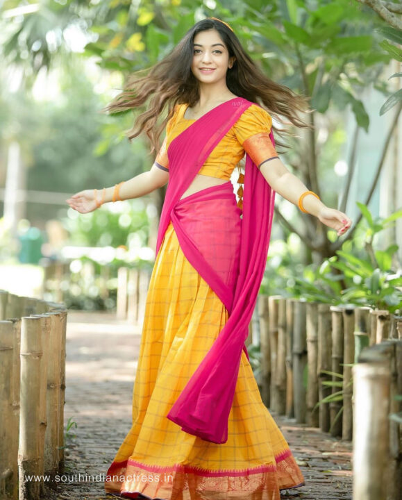 Athmika Sumithran in yellow and pink half saree