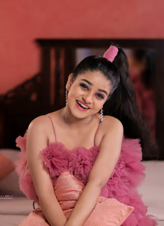 Saniya Babu beautiful stills in pink outfit