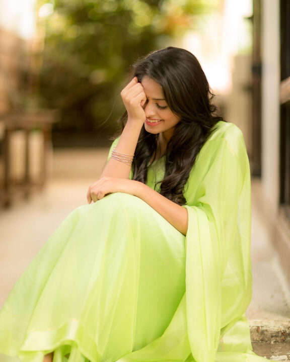 Dharshana Asokan in lime green chiffon saree stills