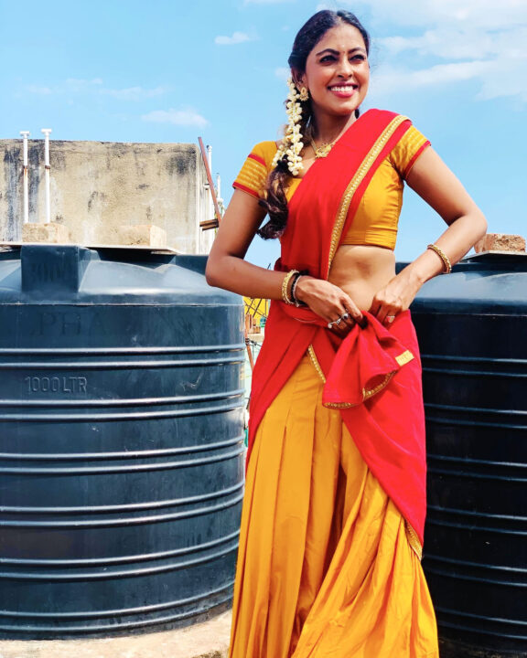 Sri Nikha hot stills in half saree