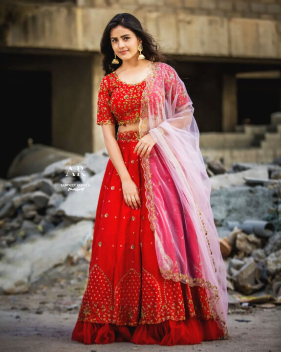 Thanuja Puttaswamy wearing red lehenga styled by Aarushi Reddy