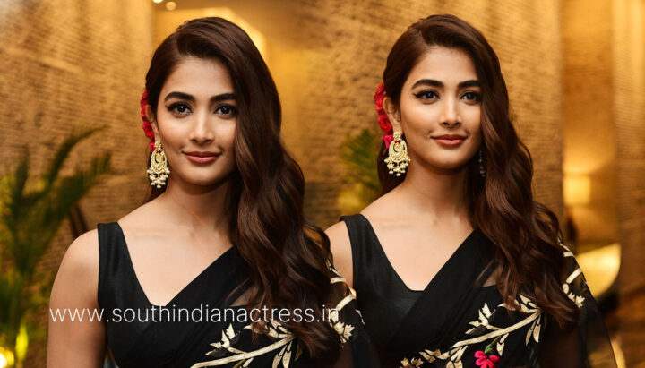 Pooja Hegde in black saree stills at Acharya pre release