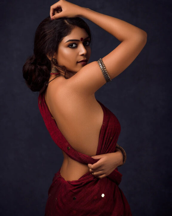 Raksha Cherin sizzling in blouse-less saree