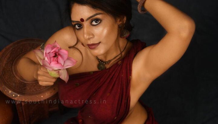 Raksha Cherin sizzling in blouse-less saree