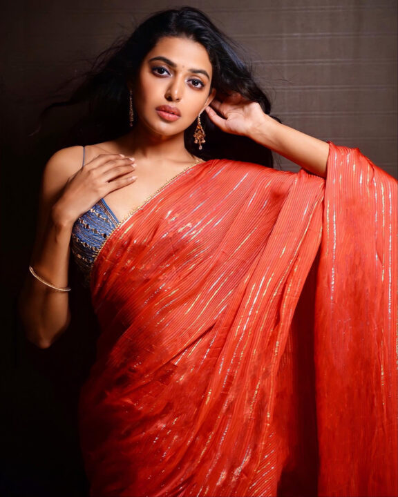 Shivani Rajashekar sizzles in red saree