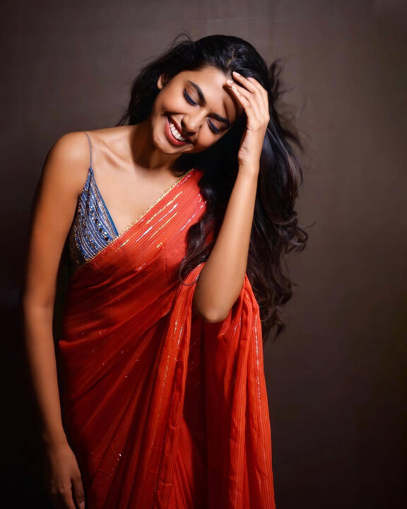 Shivani Rajashekar sizzles in red saree