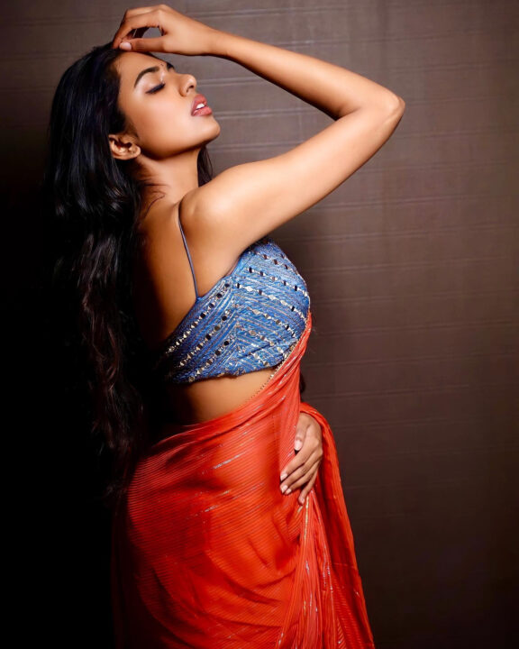 Shivani Rajashekar sizzles in red saree
