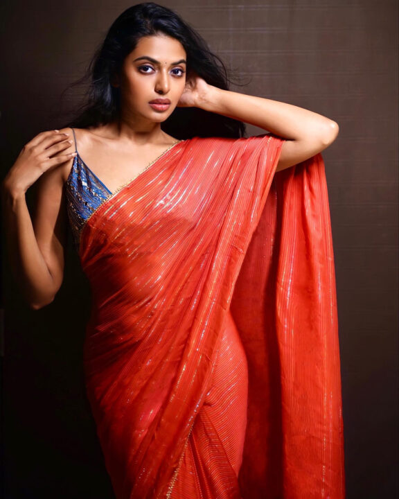 Shivani Rajashekar sizzles in red saree