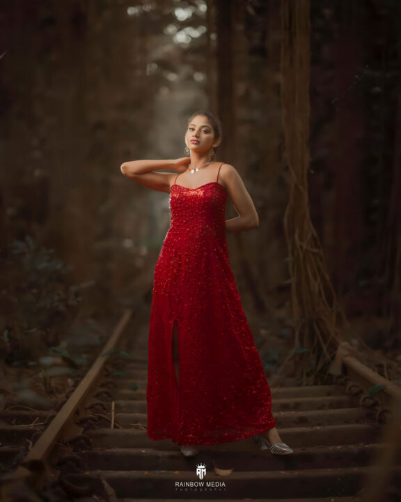 Ann Sindhu stills in red split cocktail dress