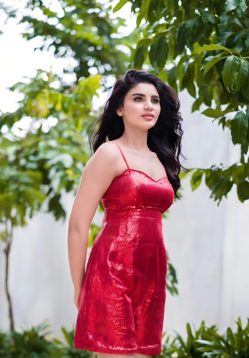 Jabardasth Varsha sizzles in red short dress
