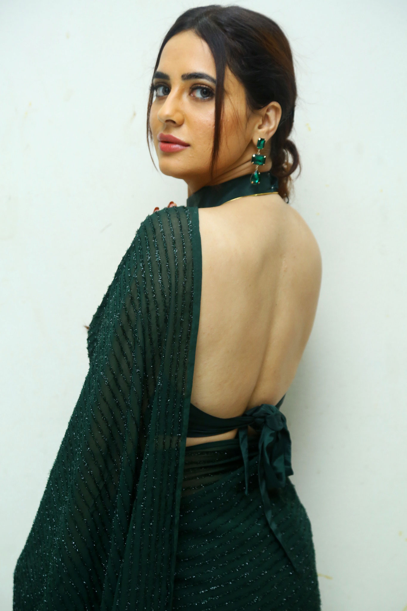 Divi Shines with Backless Saree Style