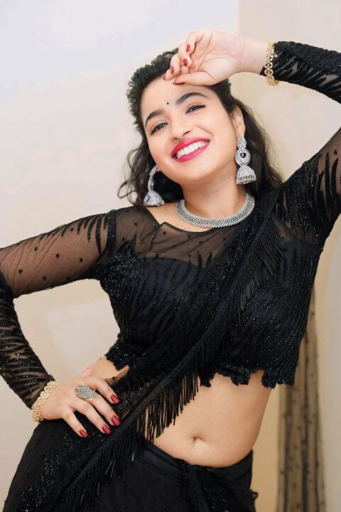Rathika Rose hot navel stills in black saree