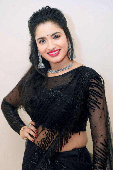 Rathika Rose hot navel stills in black saree