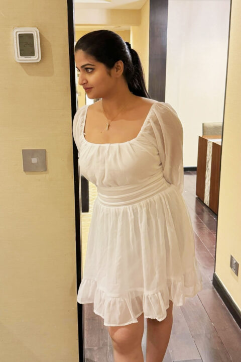 Rupa Muggalla in white short dress