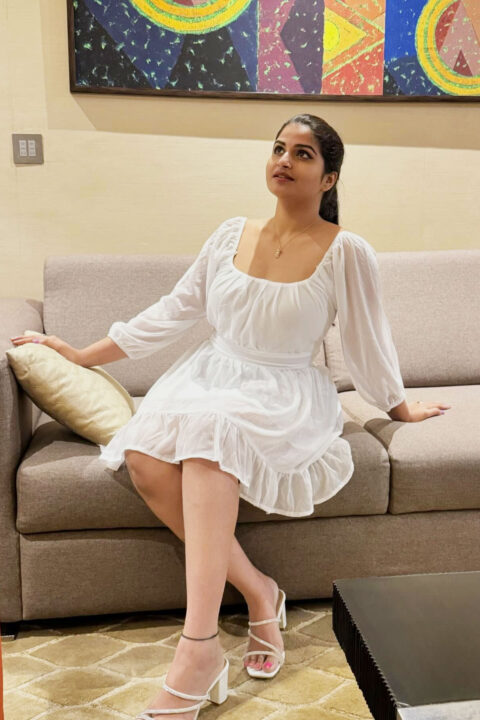 Rupa Muggalla in white midi dress