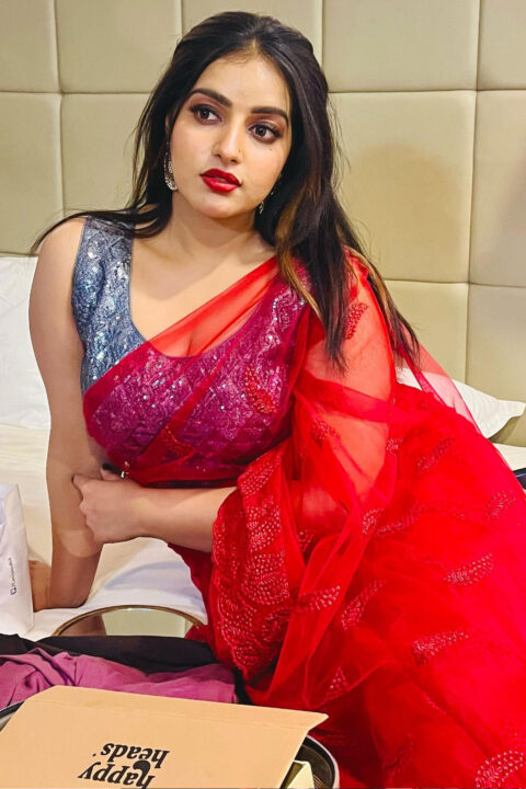Malavika Menon seductive stills in red saree