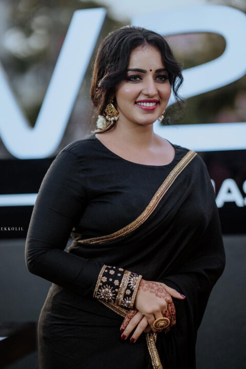 Malavika Menon glam stills in black saree