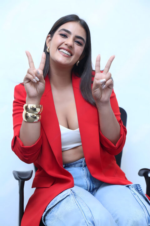 Kavya Thapar Dazzles in Unbuttoned Red Blazers at Double iSmart Event