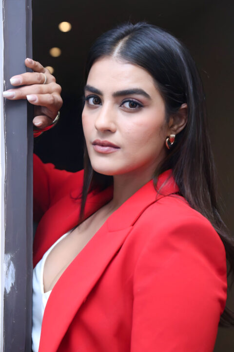 Kavya Thapar Shines in Unbuttoned Red Blazers at Double iSmart Event