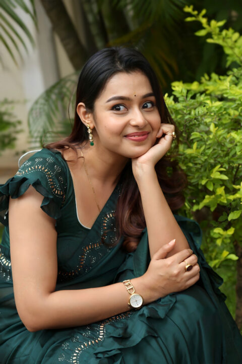 Mokksha Captivates in Dark Green Saree at Movie Success Meet