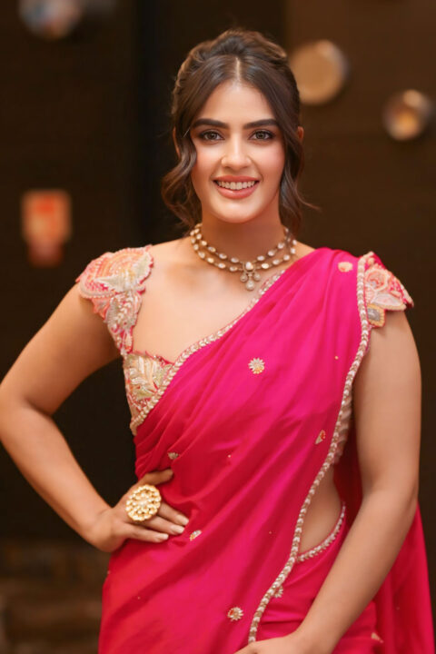 Kavya Thapar Graceful Look in Pink Saree at Viswam Pre-Release Event