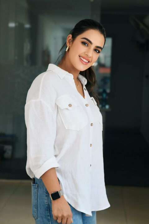 Kavya Thapar Stuns in White Shirt and Denim at Viswam Success Celebration