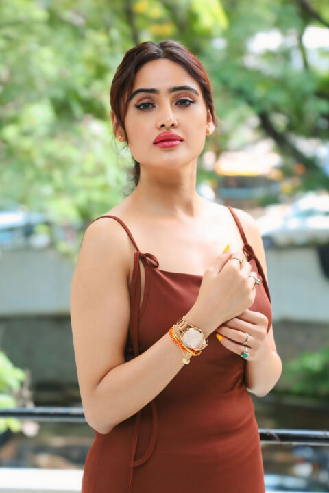 Sony Charishta Rocks Maroon Dress at Iddaru Pre-Release Event