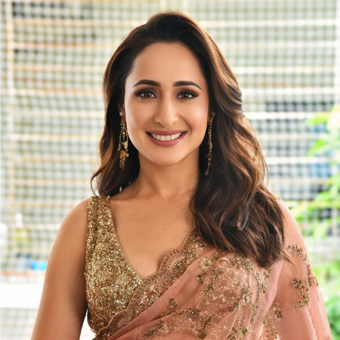 Pragya Jaiswal Dazzles in Peach Net Saree at Daaku Maharaj Success Meet