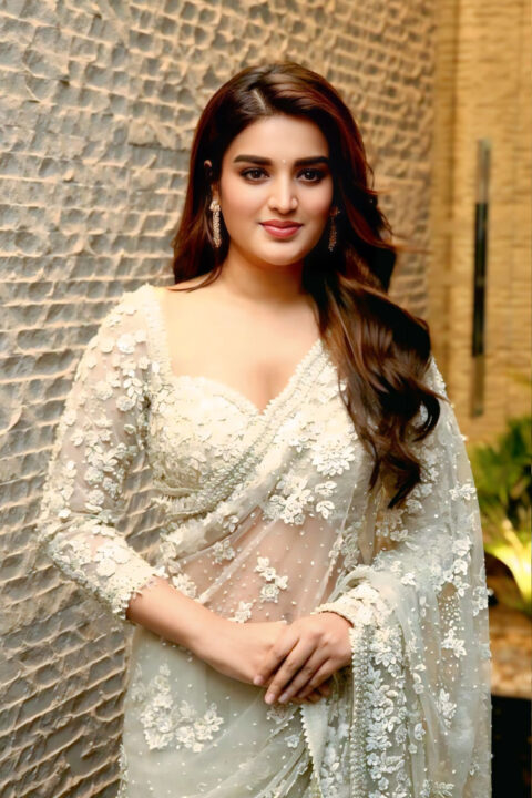 Nidhhi Agerwal turns heads in white net saree at Veera Mallu event