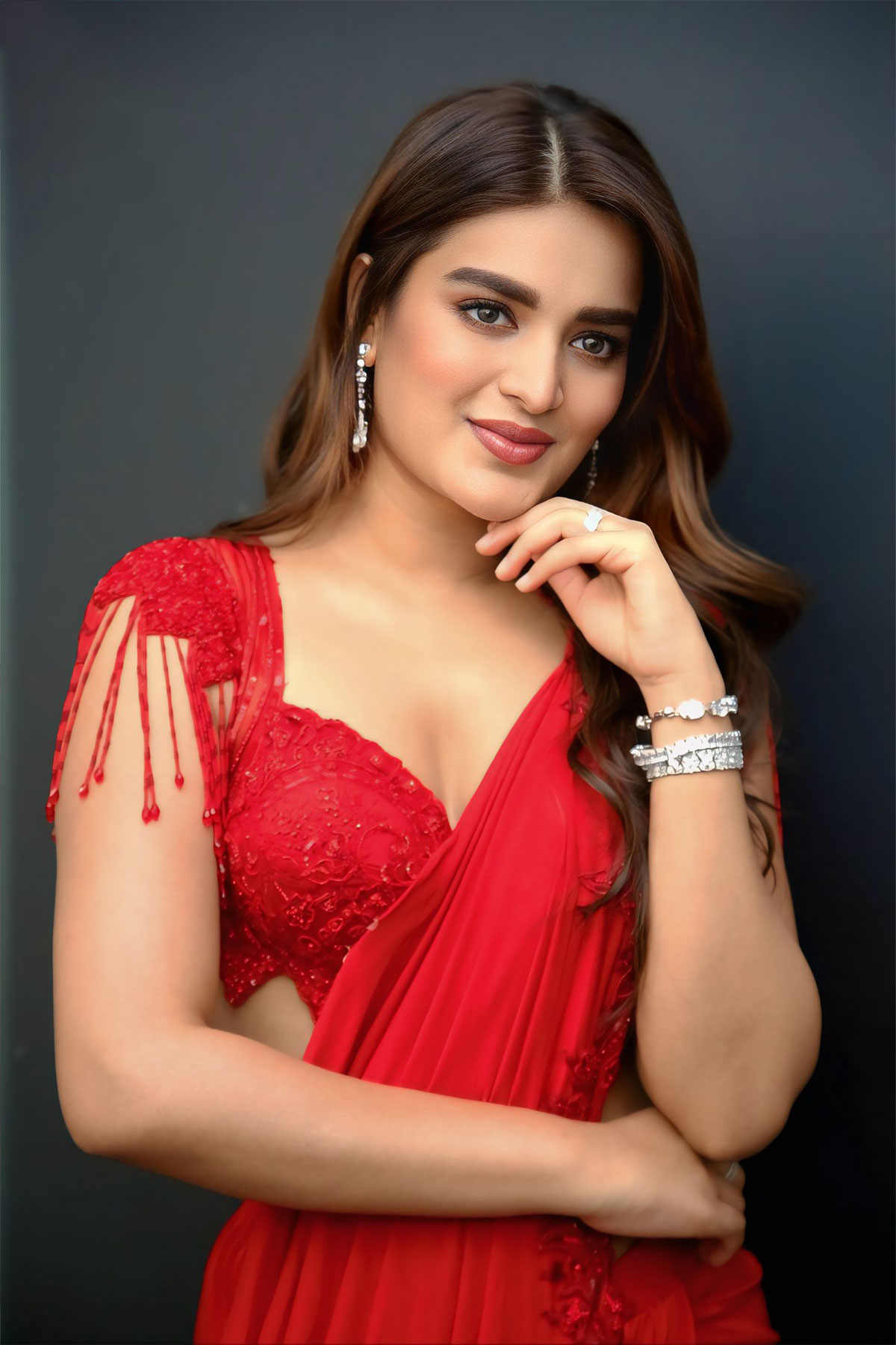 Nidhhi Agerwal’s Regal Appearance in Red Saree for Interview