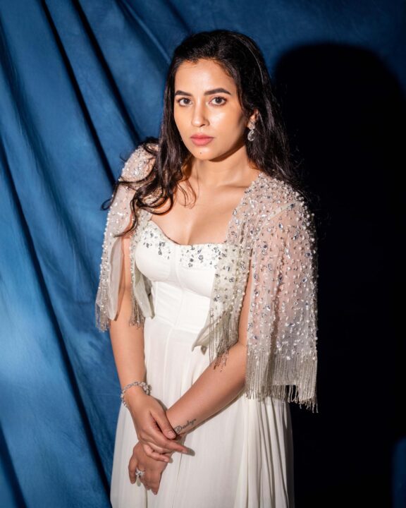 Komalee Prasad Angelic White Gown Stills Against a Blue Backdrop