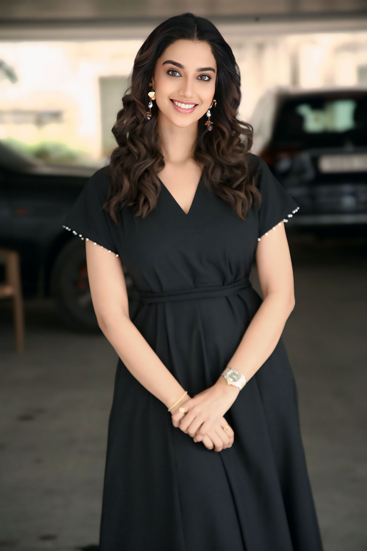 Meenakshi Chaudhary Stays Chic in Black for Anaganaga Oka Raju