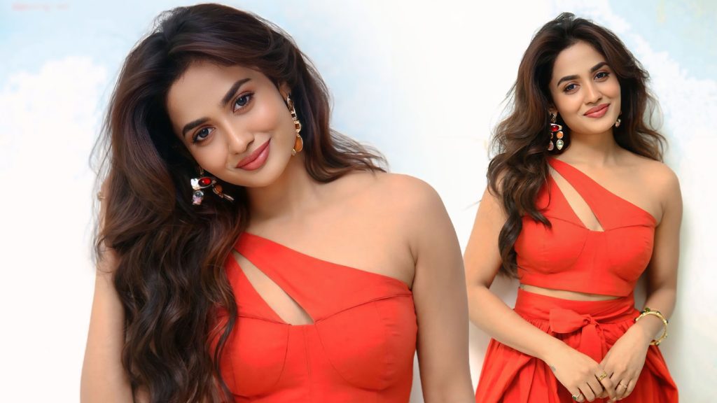 Teju Ashwini in Sizzling Orange Co-ord Set at the Nawab Cafe Press Meet
