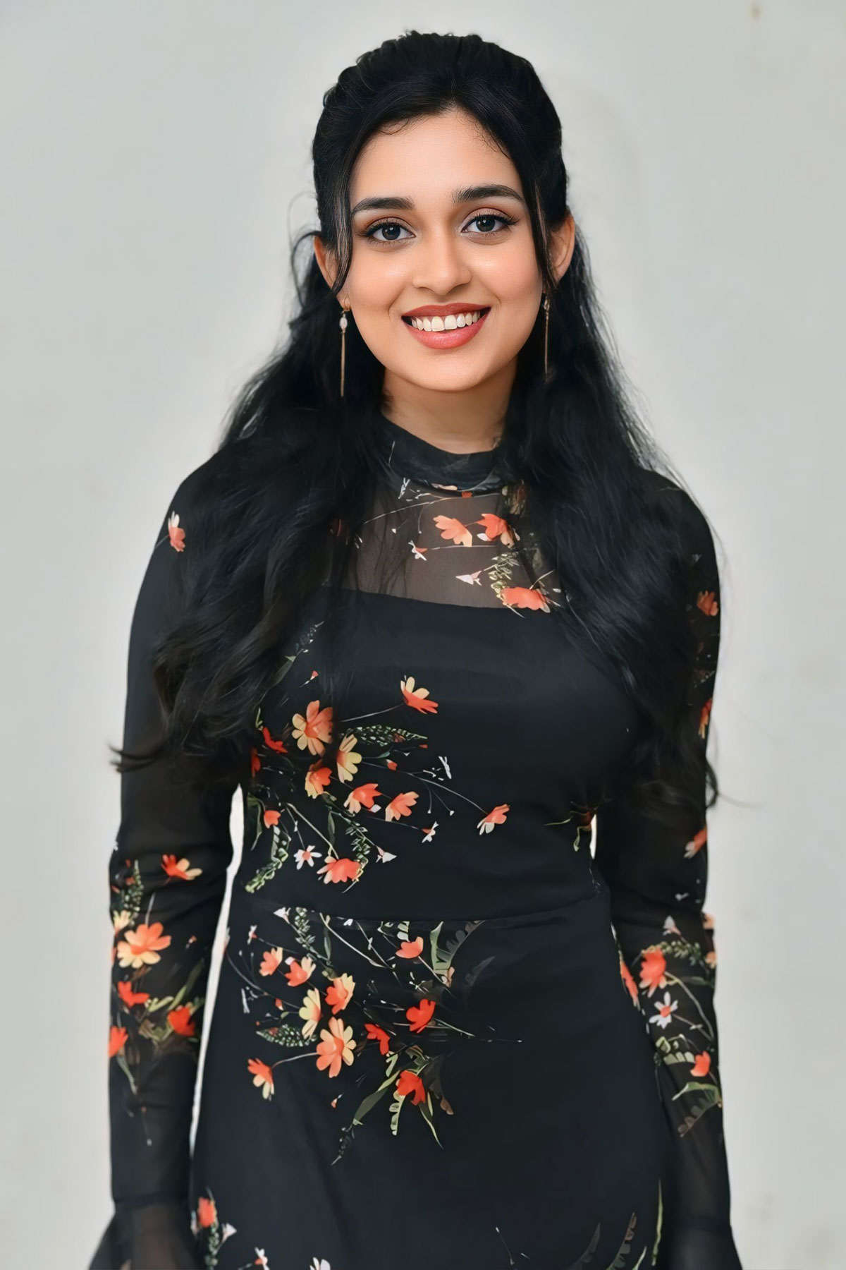 Nidhi Pradeep Dazzles in Black & Orange Ruffled Flared Dress