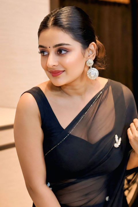 Esther Anil sizzling stills in Black Organza Saree photos